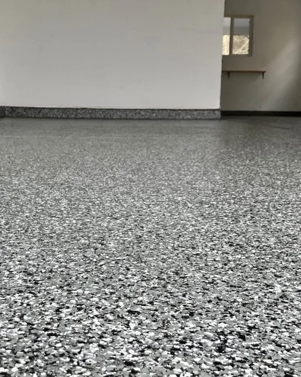 After photo of a Plano garage with a finished flake epoxy floor coating