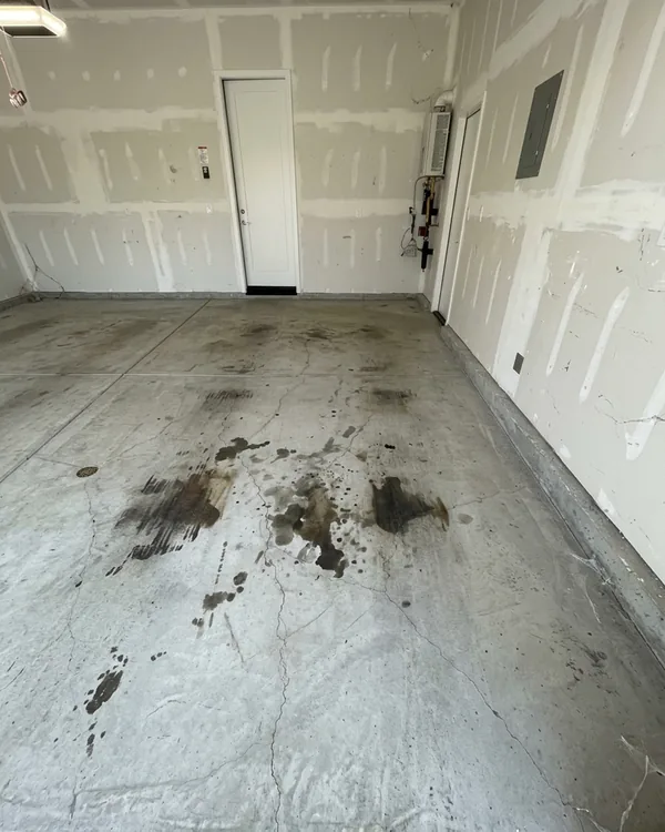 Before photo of a Southlake garage with plain concrete and visible wear