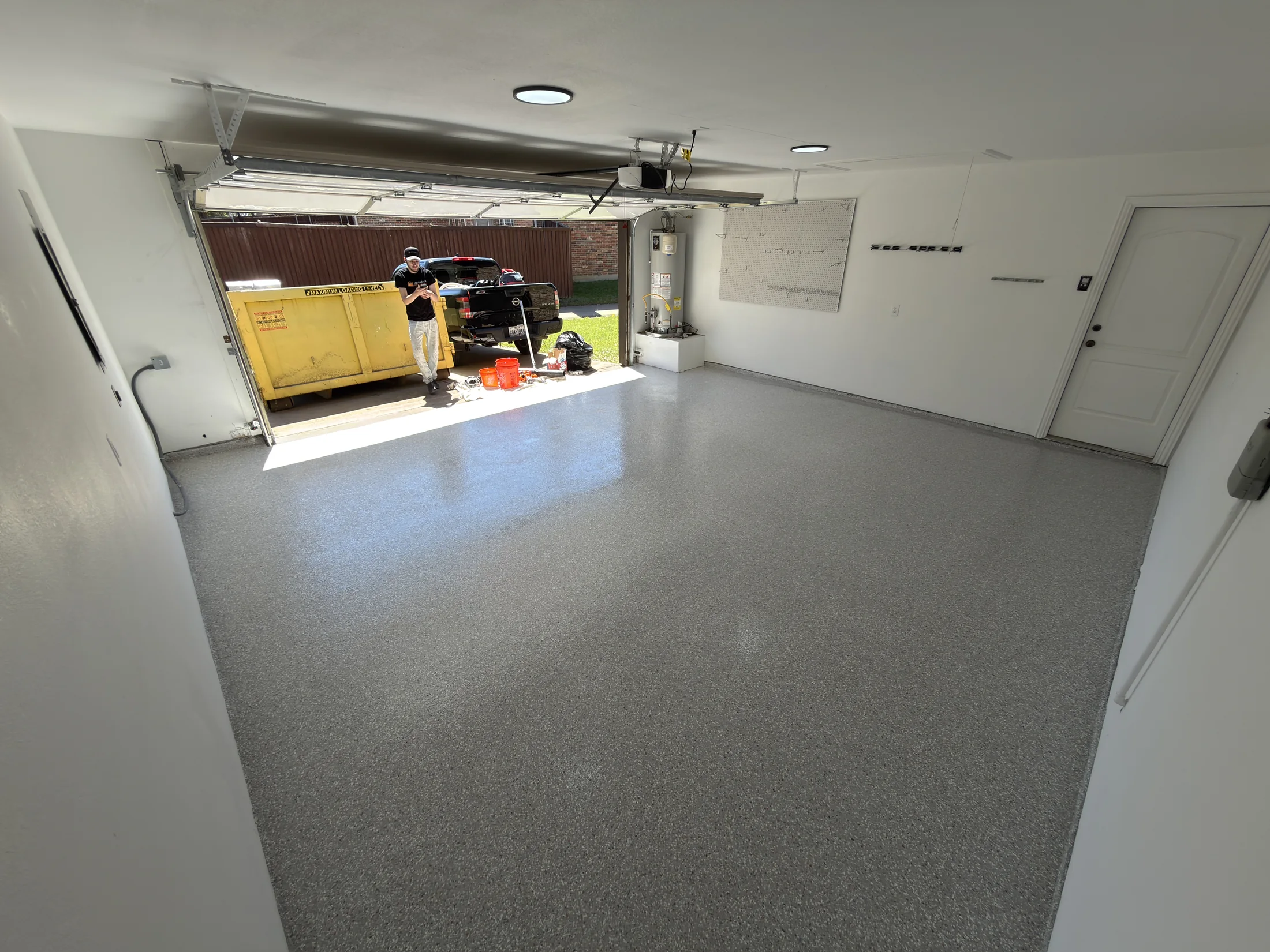 Wide view of a finished garage floor coating in Allen, Texas