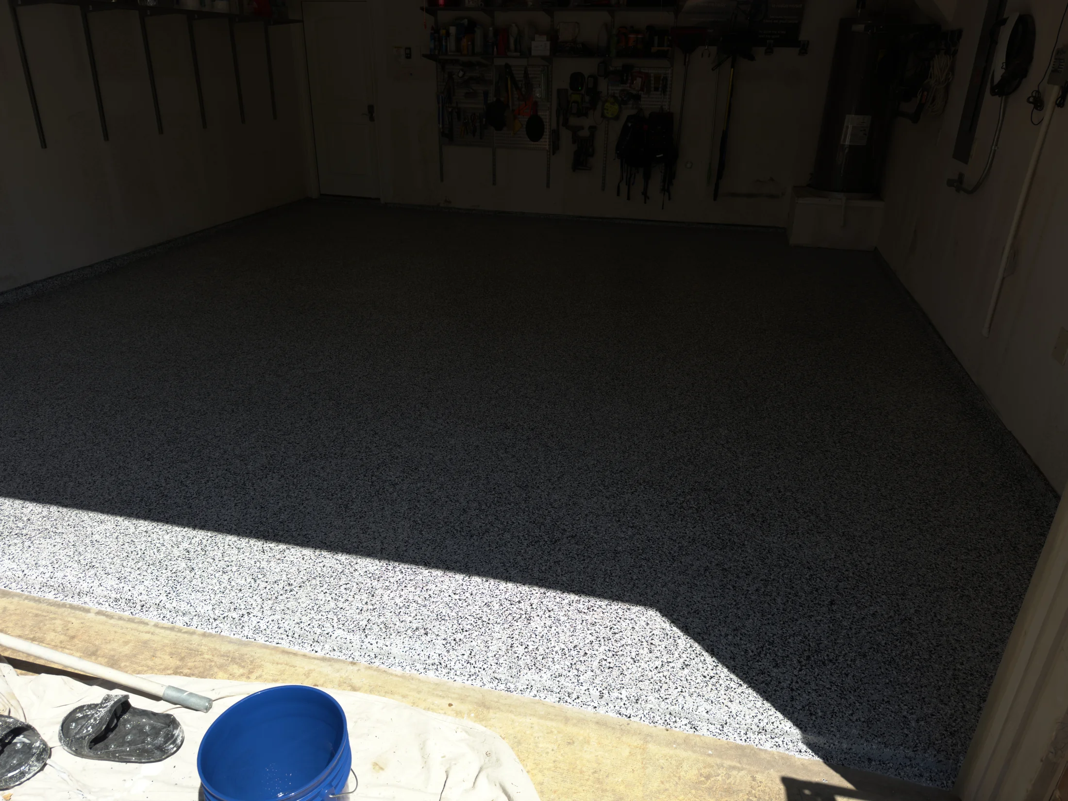 Wide view of a finished garage floor coating in Aubrey, Texas