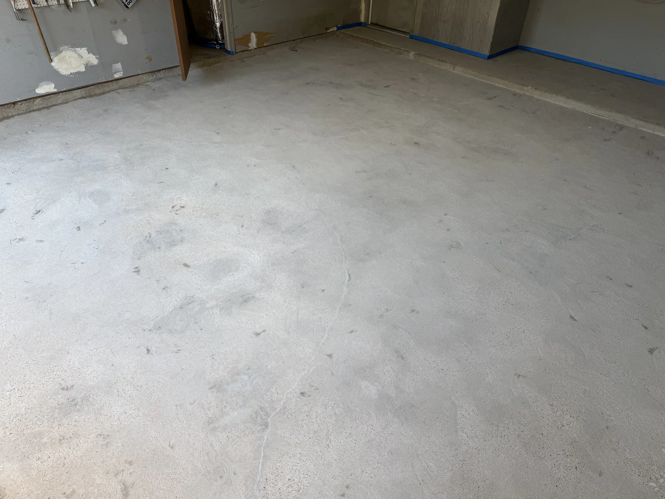 Garage floor being ground and prepped for coating in Euless, Texas
