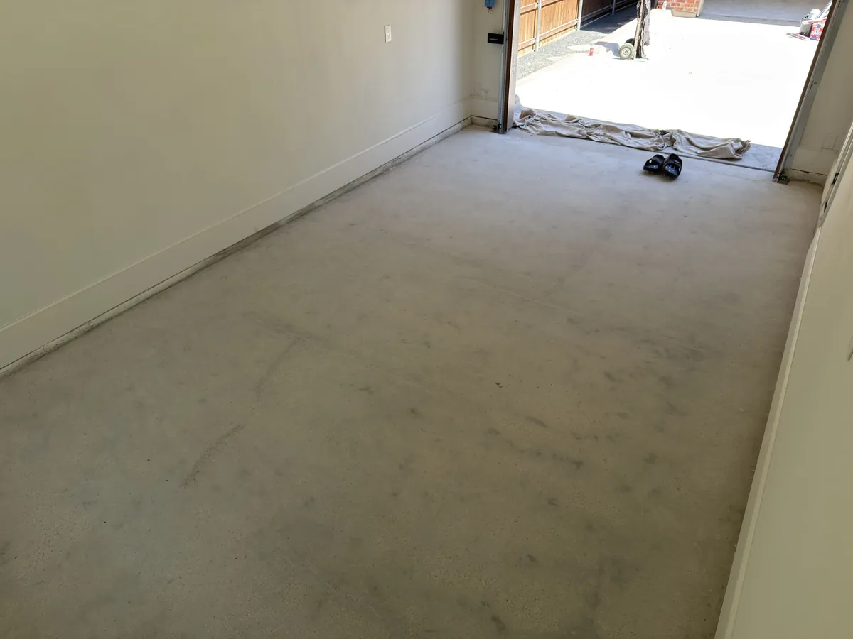 Concrete slab in a 1-car Fort Worth garage after grinding and prep for floor coating