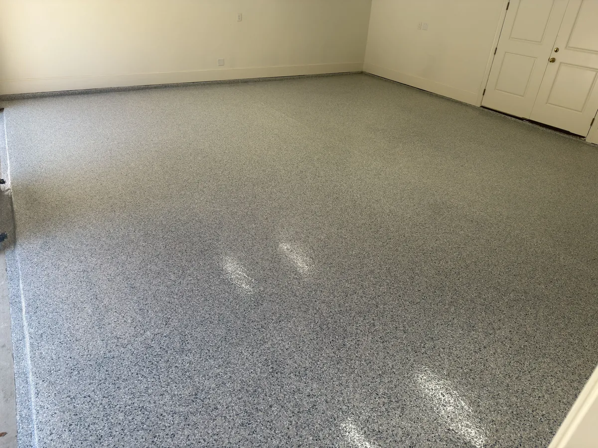 After photo of a 2-car garage in Fort Worth, Texas with a finished full-flake floor coating