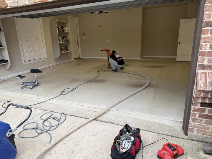 Before photo of a 670 sq ft garage floor coating project in Colleyville, Texas.