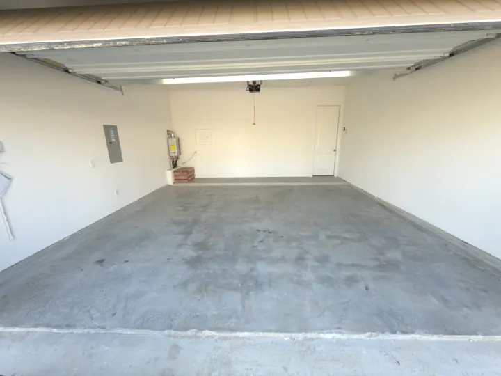 Before photo of a 400 sq ft garage floor coating project in Fort Worth, Texas.